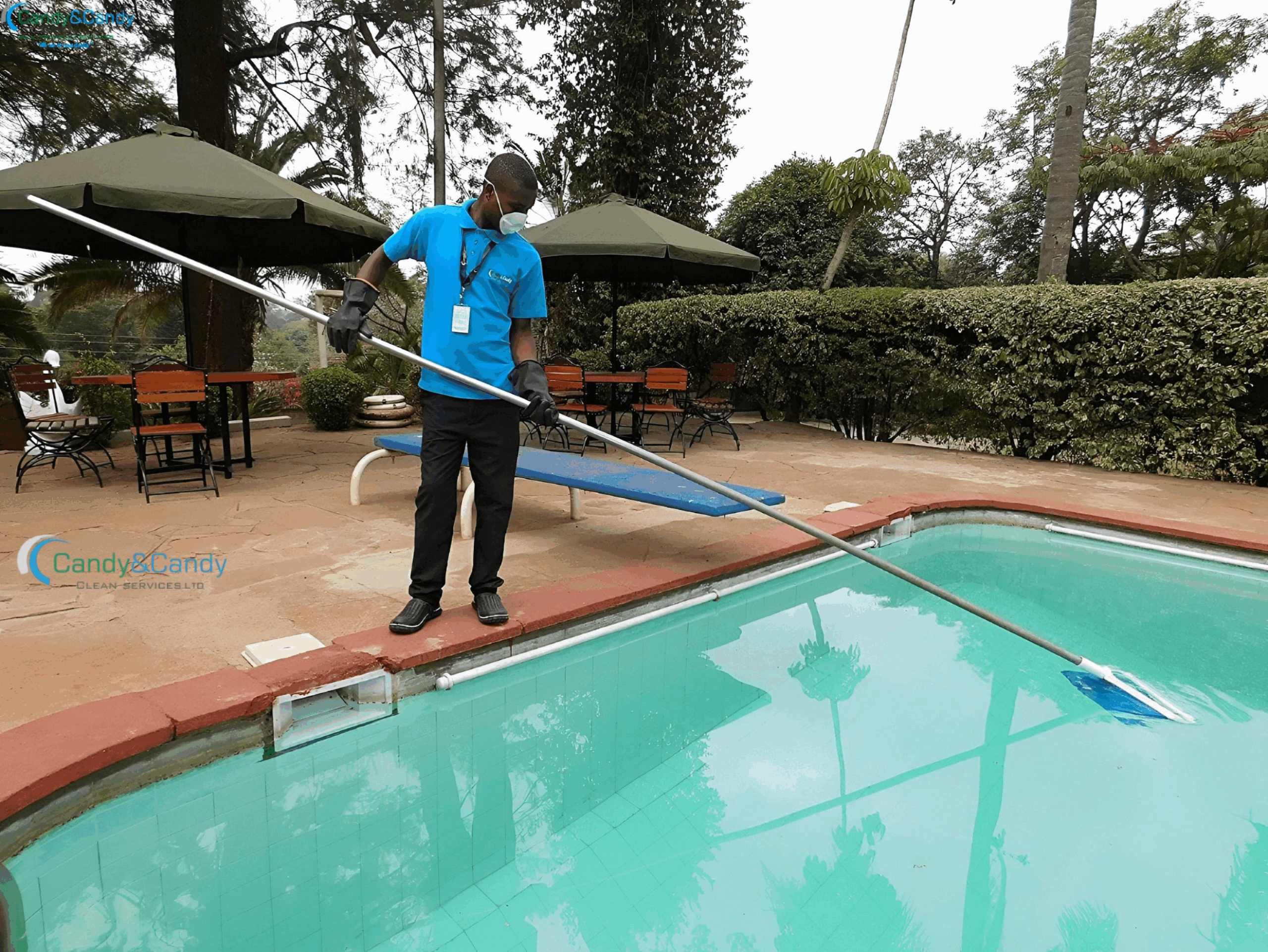 Trained pool cleaning professional working on residential swimming pool in Nairobi, Kenya